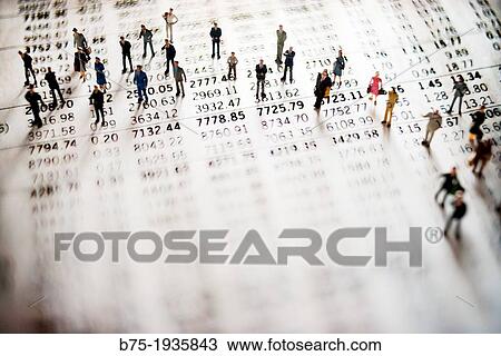 Stock Image - digital composition of people walking on a graph of a Stock Market Numbers. Fotosearch