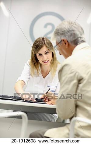 Stock Photo - Digital signature, Reception of patients, Onkologikoa Hospital, Oncology Institute, Case Center for prevention, diagnosis and treatment of cancer, Donostia, San Sebastian, Gipuzkoa, Basque Country, Spain. Fotosearch