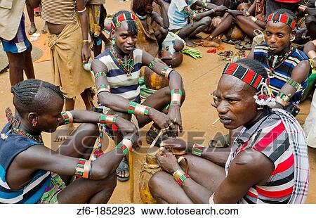 Dimeka Ethiopia Africa Lower Omo Valley market with Bena boys talking in group 16 View Large Photo Image Stock Image - Dimeka Ethiopia Africa Lower Omo Valley market with Bena boys talking in group 16. Fotosearch