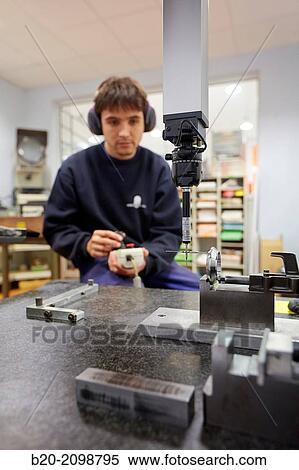 Stock Photography - Dimensional control measures. Quality control. Machined Indecober. Machining of precision parts in series. Automotive industry. Berriz. Bizkaia. Basque Country. Spain.. Fotosearch