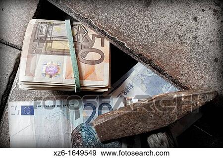 Dinero Euros escondido bajo el suelo View Large Photo Image Stock Photo - Dinero Euros escondido bajo el suelo. Fotosearch
