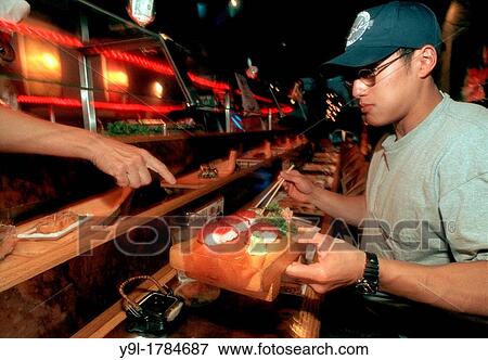 Diners at Tsunami Sushi Restaurant in Greenwich Village in New York take advantage of the? All You Can Eat Sushi? The special is especially popular with the New York University students that study nearby View Large Photo Image Stock Photo - Diners at Tsunami Sushi Restaurant in Greenwich Village in New York take advantage of the? All You Can Eat Sushi? The special is especially popular with the New York University students that study nearby. Fotosearch