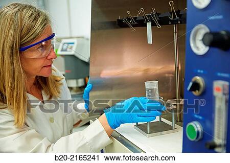 Stock Image - Dip-coating. Laboratory. Energy and Environment Division. Tecnalia Research and Innovation. Derio. Bizkaia. Basque Country. Spain.. Fotosearch