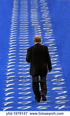 diplomat walking on decorative long carpet showing dates of all years of ILO activity since its establishment in 1919 within League of Nations till today, main hall in building of ILO - International Labour Office, Geneva, Switzerland, Europe View Large Photo Image Stock Photo - diplomat walking on decorative long carpet showing dates of all years of ILO activity since its establishment in 1919 within League of Nations till today, main hall in building of ILO - International Labour Office, Geneva, Switzerland, Europe. Fotosearch