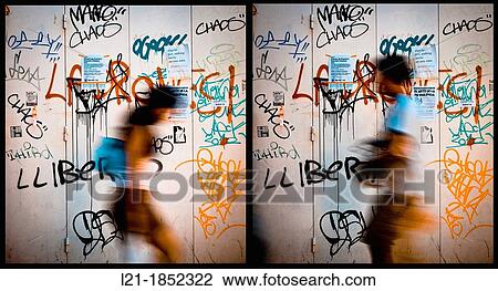 Diptych. Composition. Woman and man in motion, silhouettes, walking to the same place, to collide. Idea of conflict in the couple. In the background, painted graffiti. View Large Photo Image Stock Image - Diptych. Composition. Woman and man in motion, silhouettes, walking to the same place, to collide. Idea of conflict in the couple. In the background, painted graffiti.. Fotosearch