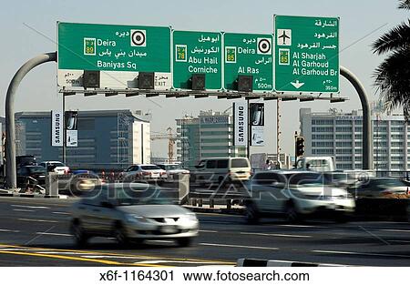 Directional road signs in English and Arabic above the multi-lane roads in Dubai, United Arab Emirates View Large Photo Image Stock Image - Directional road signs in English and Arabic above the multi-lane roads in Dubai, United Arab Emirates. Fotosearch