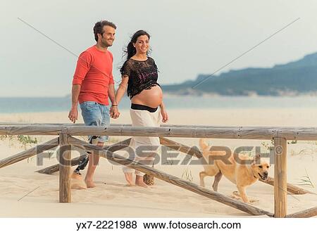 Disabled man with pregnant woman and there labrador. Tarifa, Cadiz, Andalusia, Spain, Europe. View Large Photo Image Stock Photo - Disabled man with pregnant woman and there labrador. Tarifa, Cadiz, Andalusia, Spain, Europe.. Fotosearch