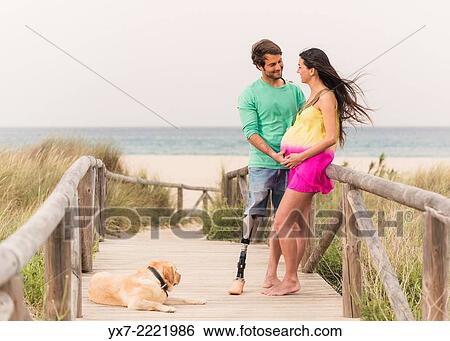 Disabled man with pregnant woman and there labrador. Tarifa, Cadiz, Andalusia, Spain, Europe. View Large Photo Image Stock Photograph - Disabled man with pregnant woman and there labrador. Tarifa, Cadiz, Andalusia, Spain, Europe.. Fotosearch