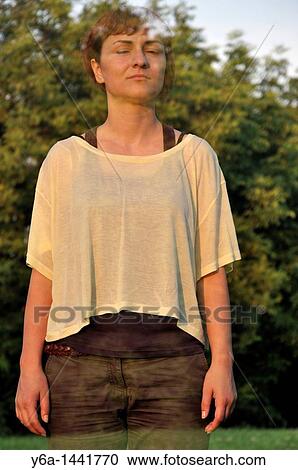 Stock Image - Disappearing young woman. Fotosearch