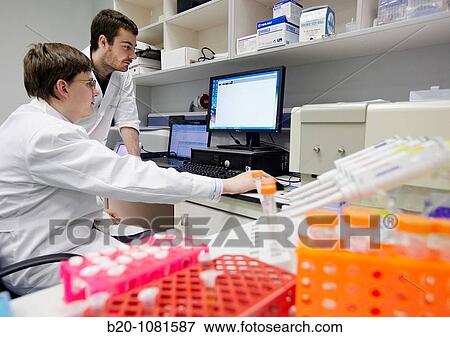 Stock Photo - Discussing fluorimeter data from a biological sample, Characterization Laboratory, CIC nanoGUNE Nanoscience Cooperative Research Center, Donostia, Gipuzkoa, Euskadi, Spain. Fotosearch