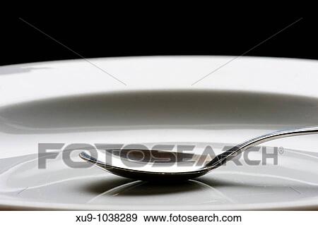 Dish and spoon View Large Photo Image Stock Photo - Dish and spoon. Fotosearch