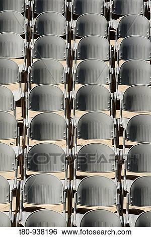disposicion simetrica de sillas de metal para un espectaculo. symmetrical arrangement of metal chairs for a show. View Large Photo Image Stock Photograph - disposicion simetrica de sillas de metal para un espectaculo. symmetrical arrangement of metal chairs for a show.. Fotosearch