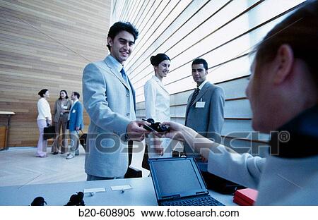 Distribution of simultaneous translation devices at business congress View Large Photo Image Stock Photography - Distribution of simultaneous translation devices at business congress. Fotosearch