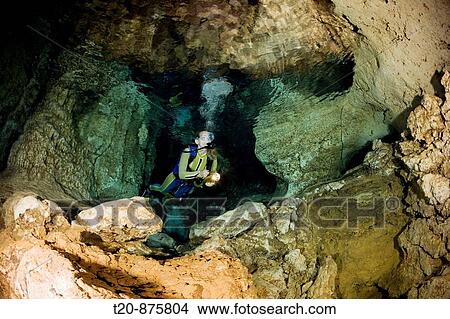 Diver in Chandelier Dripstone Cave, Micronesia, Palau View Large Photo Image Picture - Diver in Chandelier Dripstone Cave, Micronesia, Palau. Fotosearch
