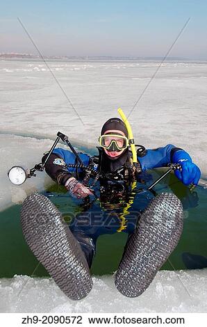 Diver, preparing for subglacial diving, ice diving, in the frozen Black Sea, a rare phenomenon, last time it occured in 1977, Odessa, Ukraine, Eastern Europe. View Large Photo Image Stock Image - Diver, preparing for subglacial diving, ice diving, in the frozen Black Sea, a rare phenomenon, last time it occured in 1977, Odessa, Ukraine, Eastern Europe.. Fotosearch