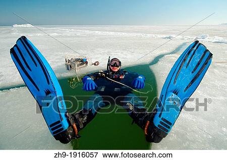 Diver, preparing for subglacial diving, ice diving, in the frozen Black Sea, a rare phenomenon, last time it occured in 1977, Odessa, Ukraine, Eastern Europe View Large Photo Image Stock Photo - Diver, preparing for subglacial diving, ice diving, in the frozen Black Sea, a rare phenomenon, last time it occured in 1977, Odessa, Ukraine, Eastern Europe. Fotosearch