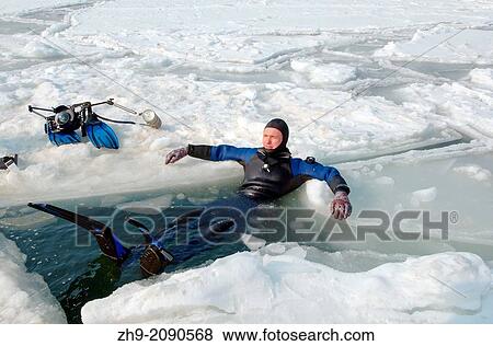Diver, preparing for subglacial diving, ice diving, in the frozen Black Sea, a rare phenomenon, last time it occured in 1977, Odessa, Ukraine, Eastern Europe. View Large Photo Image Stock Photo - Diver, preparing for subglacial diving, ice diving, in the frozen Black Sea, a rare phenomenon, last time it occured in 1977, Odessa, Ukraine, Eastern Europe.. Fotosearch