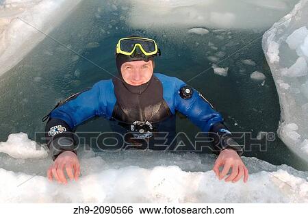 Diver, preparing for subglacial diving, ice diving, in the frozen Black Sea, a rare phenomenon, last time it occured in 1977, Odessa, Ukraine, Eastern Europe. View Large Photo Image Stock Photograph - Diver, preparing for subglacial diving, ice diving, in the frozen Black Sea, a rare phenomenon, last time it occured in 1977, Odessa, Ukraine, Eastern Europe.. Fotosearch