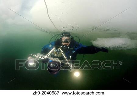 Diver, subglacial diving, ice diving, in the frozen Black Sea, a rare phenomenon, last time it occured in 1977, Odessa, Ukraine, Eastern Europe. View Large Photo Image Stock Photo - Diver, subglacial diving, ice diving, in the frozen Black Sea, a rare phenomenon, last time it occured in 1977, Odessa, Ukraine, Eastern Europe.. Fotosearch