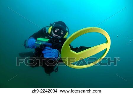 Diver with the metal detector searching for underwater treasure, lake Baikal, Siberia, Russia, Eurasia. View Large Photo Image Picture - Diver with the metal detector searching for underwater treasure, lake Baikal, Siberia, Russia, Eurasia.. Fotosearch
