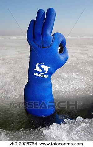 Diver's hand giving the Ok sign, subglacial diving, ice diving, in the frozen Black Sea, a rare phenomenon, last time it occured in 1977, Odessa, Ukraine, Eastern Europe. View Large Photo Image Picture - Diver's hand giving the Ok sign, subglacial diving, ice diving, in the frozen Black Sea, a rare phenomenon, last time it occured in 1977, Odessa, Ukraine, Eastern Europe.. Fotosearch