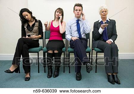 Diverse group of business people using mobile phones. View Large Photo Image Stock Photo - Diverse group of business people using mobile phones.. Fotosearch