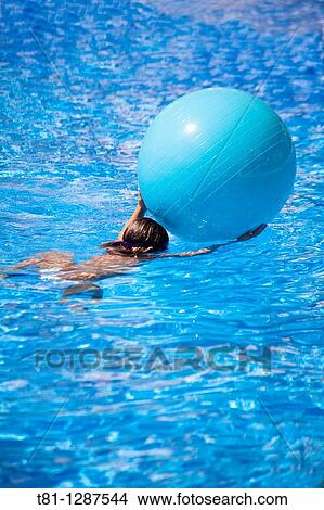 diving with ball girl View Large Photo Image Picture - diving with ball girl. Fotosearch