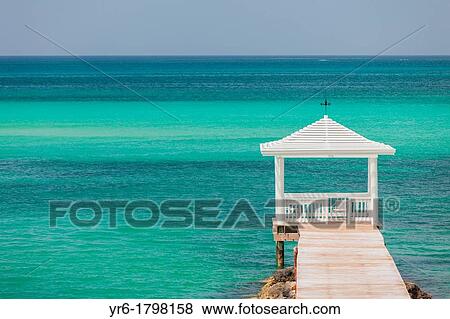 Stock Photo - Dock and gazebo with the ocean in Nassau, Bahamas. Fotosearch