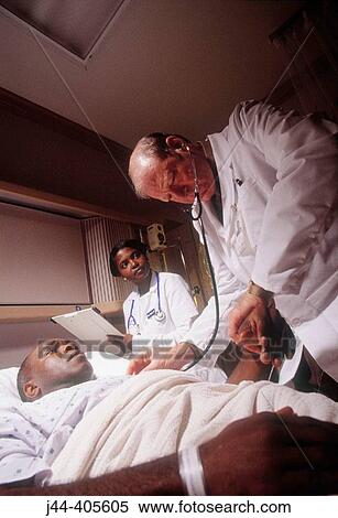 Doctor and nurse with black man patient in hospital room View Large Photo Image Stock Photography - Doctor and nurse with black man patient in hospital room. Fotosearch