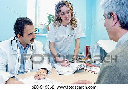 Doctor and nurse with patient in the doctor's office of hospital View Large Photo Image Stock Image - Doctor and nurse with patient in the doctor's office of hospital. Fotosearch