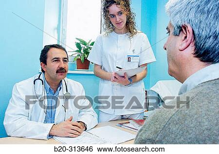 Doctor and nurse with patient in the doctor's office of hospital View Large Photo Image Stock Photograph - Doctor and nurse with patient in the doctor's office of hospital. Fotosearch