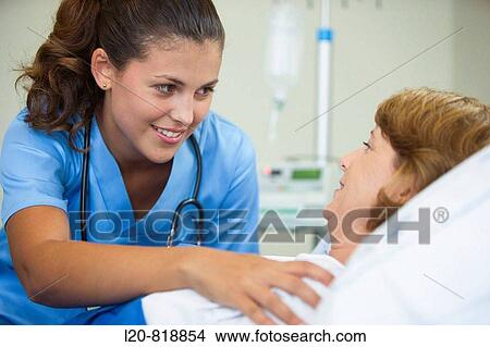 Doctor and patient in hospital room View Large Photo Image Picture - Doctor and patient in hospital room. Fotosearch