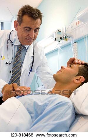 Doctor and patient in hospital room View Large Photo Image Stock Photo - Doctor and patient in hospital room. Fotosearch