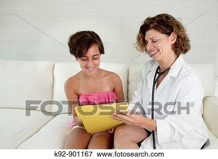 Stock Photo - Doctor and teenager. Fotosearch