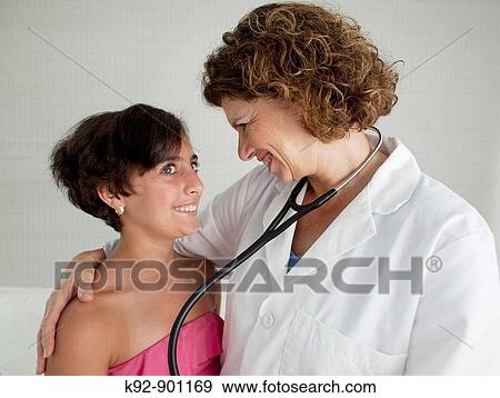 Doctor and teenager View Large Photo Image Stock Photo - Doctor and teenager. Fotosearch