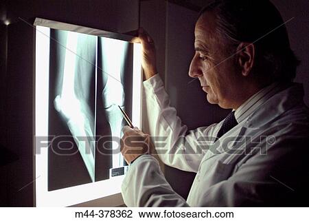Stock Image - Doctor and X-ray. Fotosearch