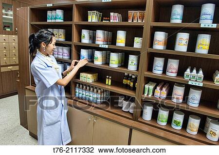 doctor at a traditional Thai medicine clinic in Bangkok, Thailand. View Large Photo Image Stock Image - doctor at a traditional Thai medicine clinic in Bangkok, Thailand.. Fotosearch