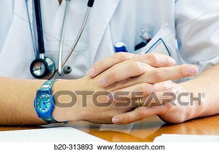 Stock Image - Doctor at training meeting in hospital. Fotosearch
