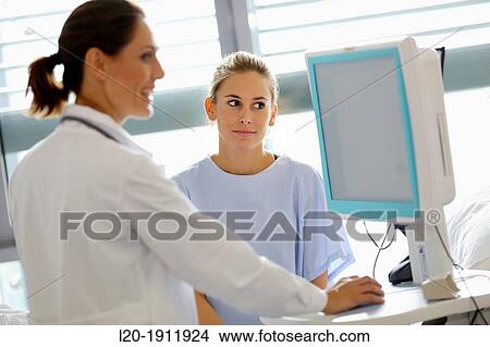 doctor attending to patient in hospital room, Onkologikoa Hospital, Oncology Institute, Case Center for prevention, diagnosis and treatment of cancer, Donostia, San Sebastian, Gipuzkoa, Basque Country, Spain View Large Photo Image Picture - doctor attending to patient in hospital room, Onkologikoa Hospital, Oncology Institute, Case Center for prevention, diagnosis and treatment of cancer, Donostia, San Sebastian, Gipuzkoa, Basque Country, Spain. Fotosearch