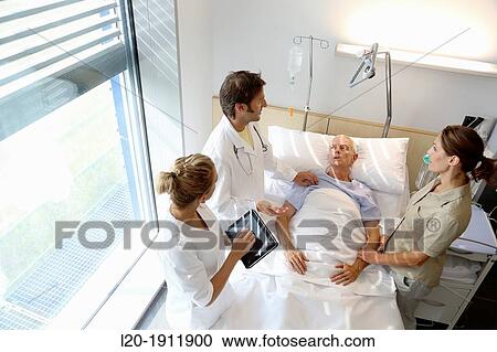 doctor attending to patient in hospital room, Onkologikoa Hospital, Oncology Institute, Case Center for prevention, diagnosis and treatment of cancer, Donostia, San Sebastian, Gipuzkoa, Basque Country, Spain View Large Photo Image Stock Image - doctor attending to patient in hospital room, Onkologikoa Hospital, Oncology Institute, Case Center for prevention, diagnosis and treatment of cancer, Donostia, San Sebastian, Gipuzkoa, Basque Country, Spain. Fotosearch