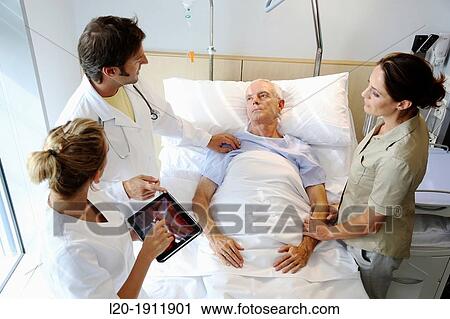 doctor attending to patient in hospital room, Onkologikoa Hospital, Oncology Institute, Case Center for prevention, diagnosis and treatment of cancer, Donostia, San Sebastian, Gipuzkoa, Basque Country, Spain View Large Photo Image Stock Image - doctor attending to patient in hospital room, Onkologikoa Hospital, Oncology Institute, Case Center for prevention, diagnosis and treatment of cancer, Donostia, San Sebastian, Gipuzkoa, Basque Country, Spain. Fotosearch