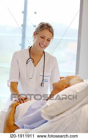 doctor attending to patient in hospital room, Onkologikoa Hospital, Oncology Institute, Case Center for prevention, diagnosis and treatment of cancer, Donostia, San Sebastian, Gipuzkoa, Basque Country, Spain View Large Photo Image Stock Image - doctor attending to patient in hospital room, Onkologikoa Hospital, Oncology Institute, Case Center for prevention, diagnosis and treatment of cancer, Donostia, San Sebastian, Gipuzkoa, Basque Country, Spain. Fotosearch