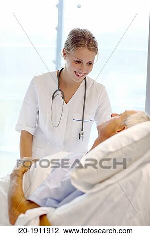 doctor attending to patient in hospital room, Onkologikoa Hospital, Oncology Institute, Case Center for prevention, diagnosis and treatment of cancer, Donostia, San Sebastian, Gipuzkoa, Basque Country, Spain View Large Photo Image Stock Image - doctor attending to patient in hospital room, Onkologikoa Hospital, Oncology Institute, Case Center for prevention, diagnosis and treatment of cancer, Donostia, San Sebastian, Gipuzkoa, Basque Country, Spain. Fotosearch