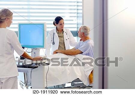 doctor attending to patient in hospital room, Onkologikoa Hospital, Oncology Institute, Case Center for prevention, diagnosis and treatment of cancer, Donostia, San Sebastian, Gipuzkoa, Basque Country, Spain View Large Photo Image Stock Image - doctor attending to patient in hospital room, Onkologikoa Hospital, Oncology Institute, Case Center for prevention, diagnosis and treatment of cancer, Donostia, San Sebastian, Gipuzkoa, Basque Country, Spain. Fotosearch