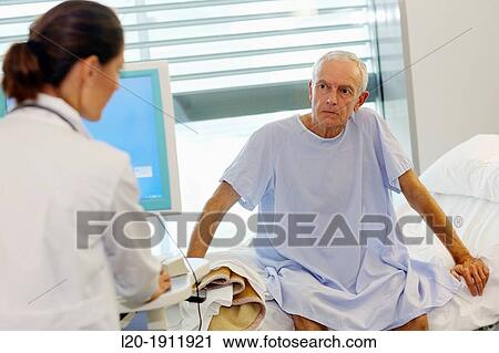 doctor attending to patient in hospital room, Onkologikoa Hospital, Oncology Institute, Case Center for prevention, diagnosis and treatment of cancer, Donostia, San Sebastian, Gipuzkoa, Basque Country, Spain View Large Photo Image Stock Image - doctor attending to patient in hospital room, Onkologikoa Hospital, Oncology Institute, Case Center for prevention, diagnosis and treatment of cancer, Donostia, San Sebastian, Gipuzkoa, Basque Country, Spain. Fotosearch