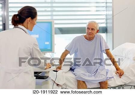 doctor attending to patient in hospital room, Onkologikoa Hospital, Oncology Institute, Case Center for prevention, diagnosis and treatment of cancer, Donostia, San Sebastian, Gipuzkoa, Basque Country, Spain View Large Photo Image Stock Image - doctor attending to patient in hospital room, Onkologikoa Hospital, Oncology Institute, Case Center for prevention, diagnosis and treatment of cancer, Donostia, San Sebastian, Gipuzkoa, Basque Country, Spain. Fotosearch