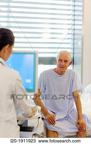 doctor attending to patient in hospital room, Onkologikoa Hospital, Oncology Institute, Case Center for prevention, diagnosis and treatment of cancer, Donostia, San Sebastian, Gipuzkoa, Basque Country, Spain View Large Photo Image Stock Image - doctor attending to patient in hospital room, Onkologikoa Hospital, Oncology Institute, Case Center for prevention, diagnosis and treatment of cancer, Donostia, San Sebastian, Gipuzkoa, Basque Country, Spain. Fotosearch