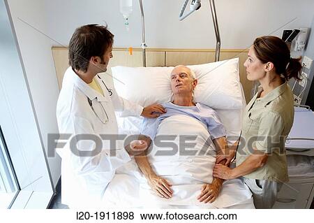 doctor attending to patient in hospital room, Onkologikoa Hospital, Oncology Institute, Case Center for prevention, diagnosis and treatment of cancer, Donostia, San Sebastian, Gipuzkoa, Basque Country, Spain View Large Photo Image Stock Photo - doctor attending to patient in hospital room, Onkologikoa Hospital, Oncology Institute, Case Center for prevention, diagnosis and treatment of cancer, Donostia, San Sebastian, Gipuzkoa, Basque Country, Spain. Fotosearch