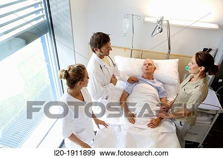 doctor attending to patient in hospital room, Onkologikoa Hospital, Oncology Institute, Case Center for prevention, diagnosis and treatment of cancer, Donostia, San Sebastian, Gipuzkoa, Basque Country, Spain View Large Photo Image Stock Photo - doctor attending to patient in hospital room, Onkologikoa Hospital, Oncology Institute, Case Center for prevention, diagnosis and treatment of cancer, Donostia, San Sebastian, Gipuzkoa, Basque Country, Spain. Fotosearch