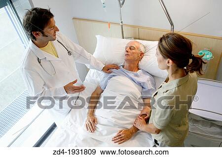 doctor attending to patient in hospital room, Onkologikoa Hospital, Oncology Institute, Case Center for prevention, diagnosis and treatment of cancer, Donostia, San Sebastian, Gipuzkoa, Basque Country, Spain View Large Photo Image Stock Photo - doctor attending to patient in hospital room, Onkologikoa Hospital, Oncology Institute, Case Center for prevention, diagnosis and treatment of cancer, Donostia, San Sebastian, Gipuzkoa, Basque Country, Spain. Fotosearch